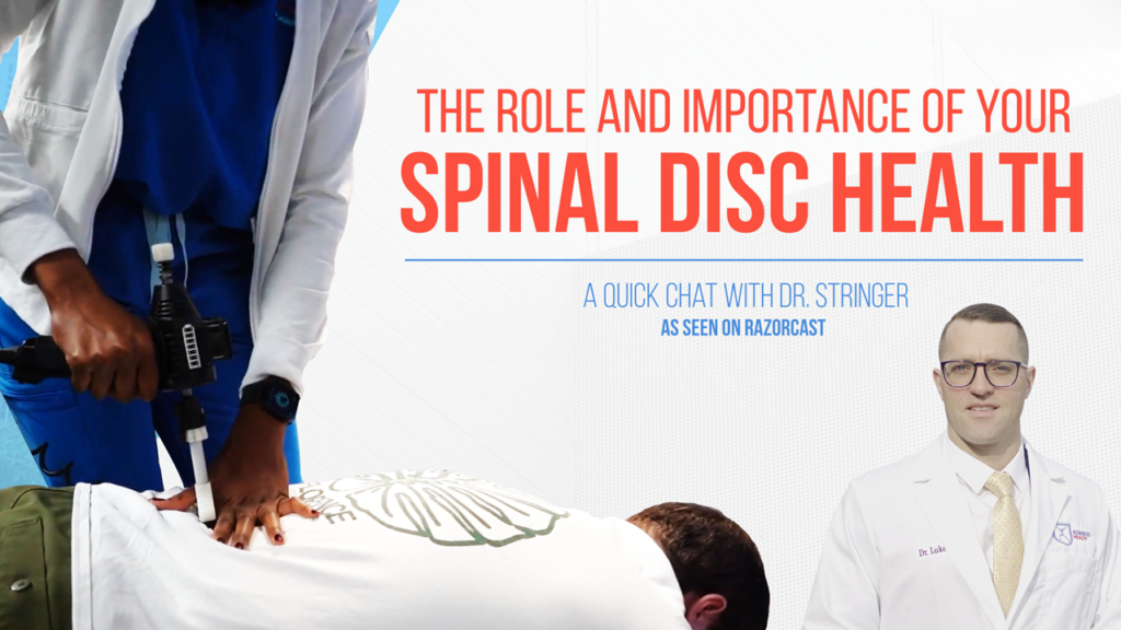 Chiropractor adjusting a patient's spine.